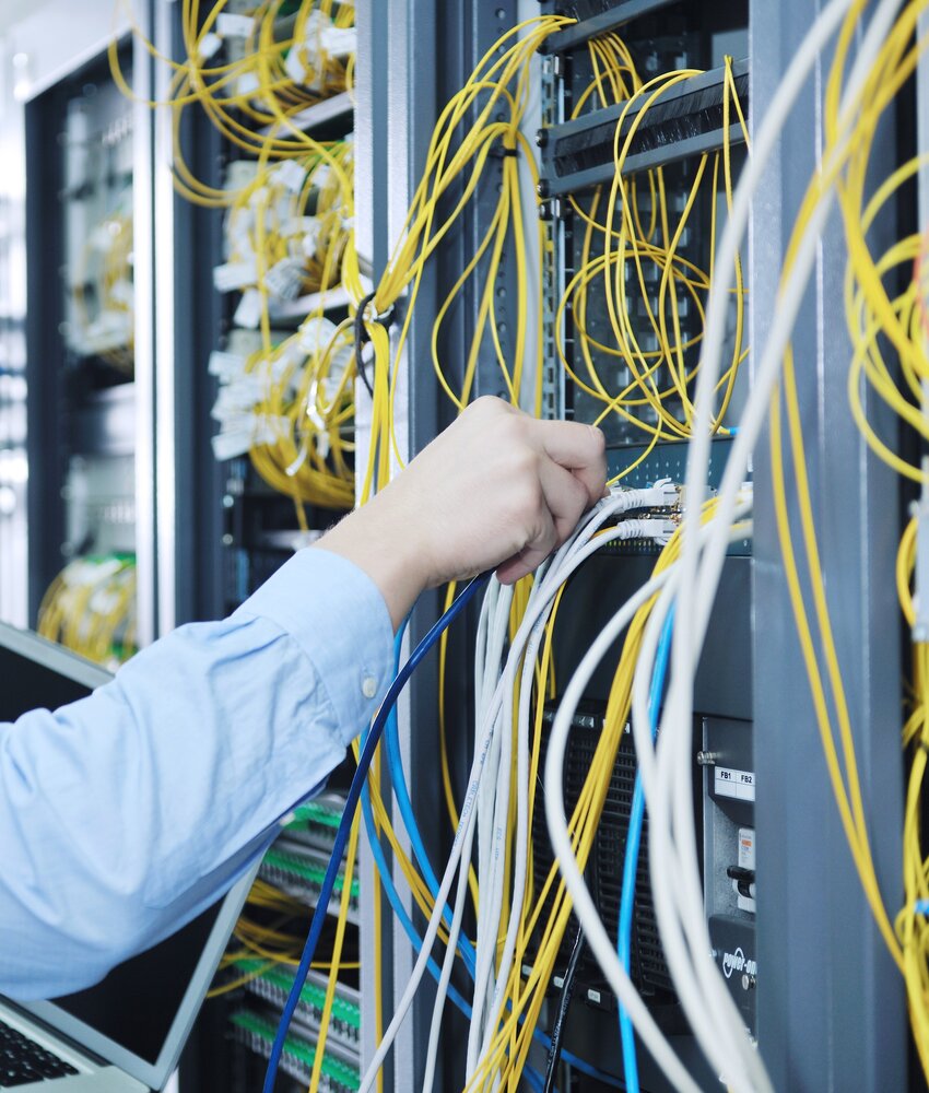 rsz 1businessman with laptop network server room